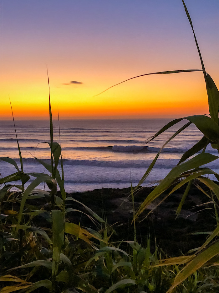 Sunset in Ericeira with many waves coming from the sea