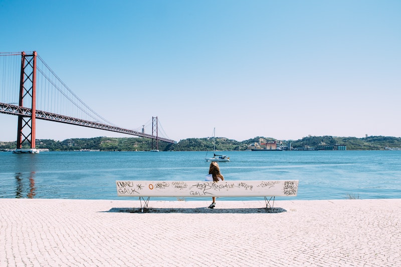 A promenade by the Tagus in Lisbon with 25 Abril Ponte in the background