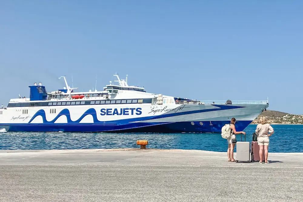 2 people waiting for the ferry in Greece