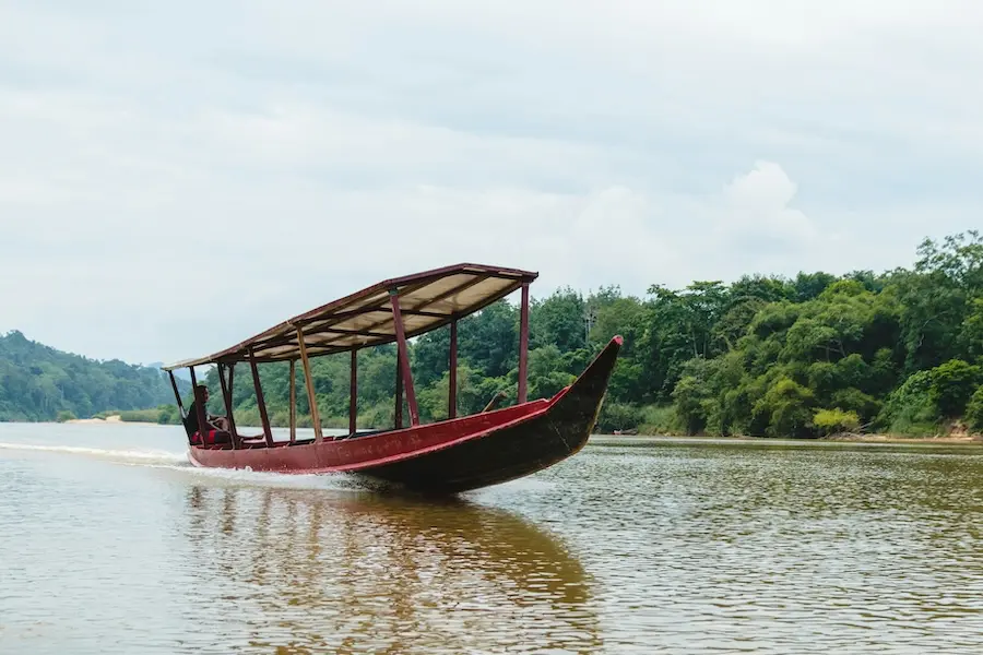 Old wooden boat on Tembeling River in Taman Negara